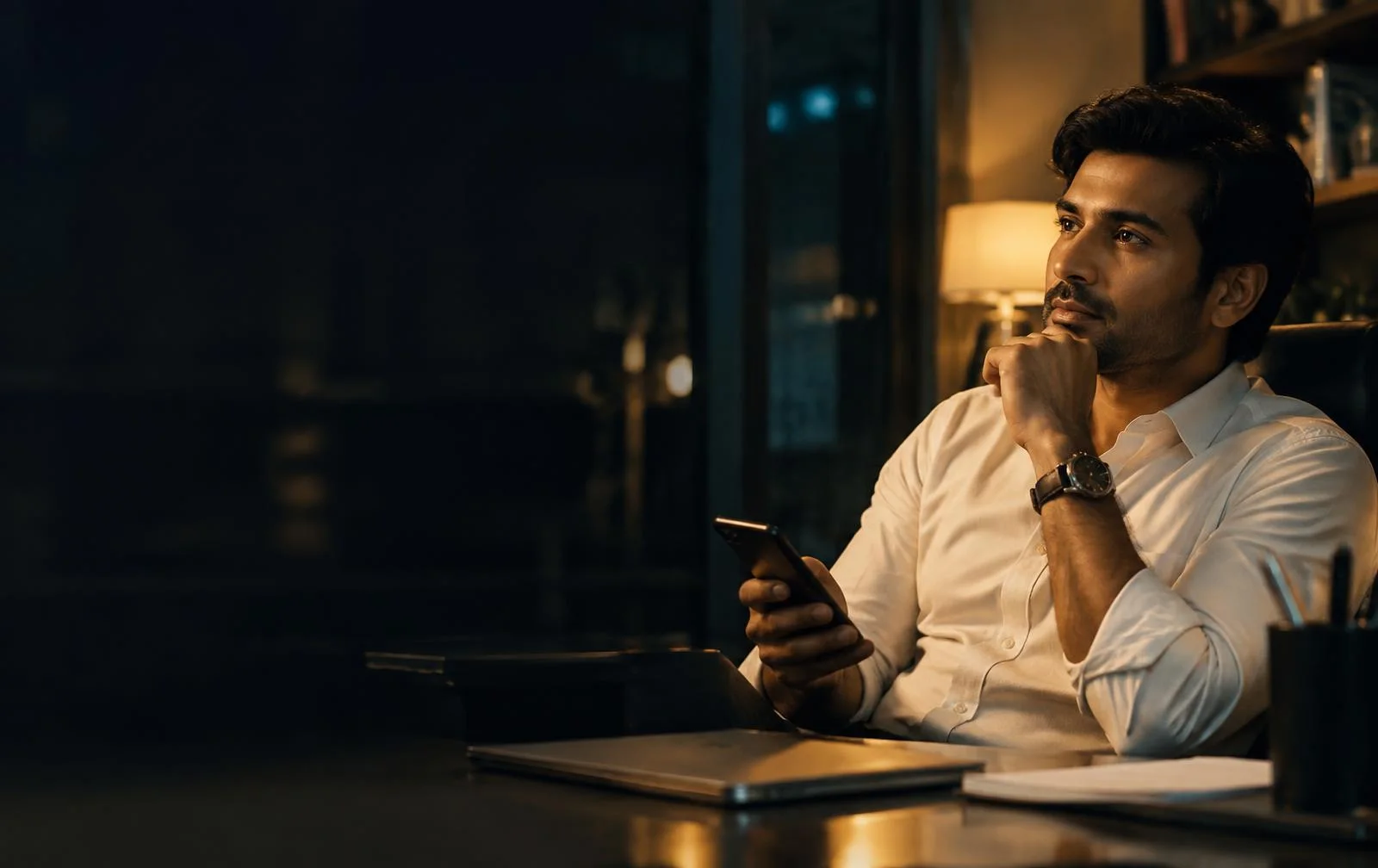 Professional reviewing campaign details on a smartphone